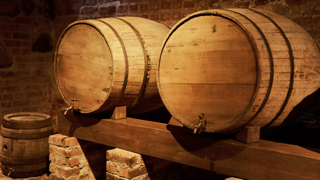 Wine region Italy Oak barrels in the wine cellar during barrel storage